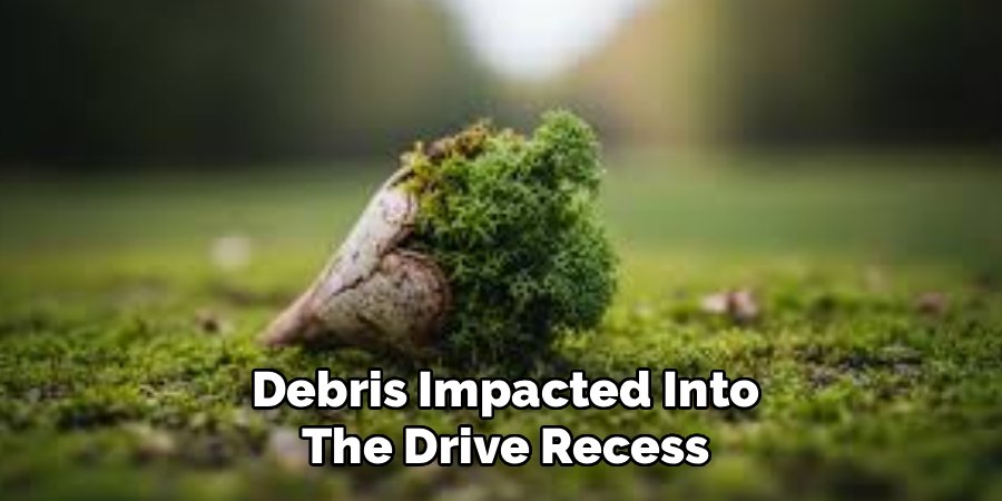 Debris Impacted Into
The Drive Recess