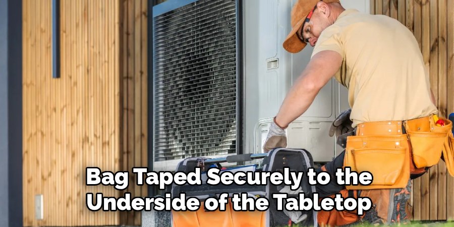 Bag Taped Securely to the
Underside of the Tabletop
