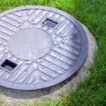 How to Hide Sewer Cover in Yard