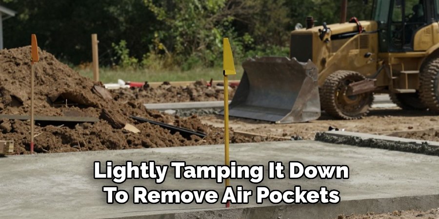  Lightly Tamping It Down 
To Remove Air Pockets