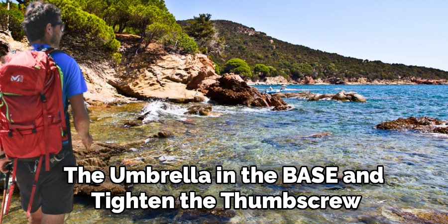 The Umbrella in the BASE and
Tighten the Thumbscrew