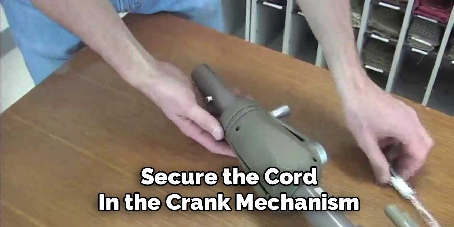 Secure the Cord in the Crank Mechanism
